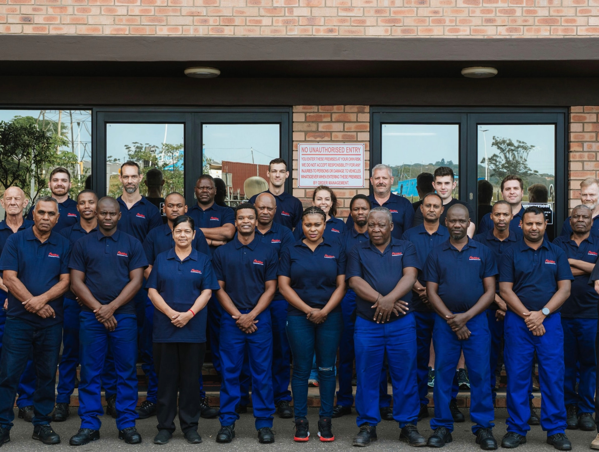 The ManuMark team outside the factory entrance